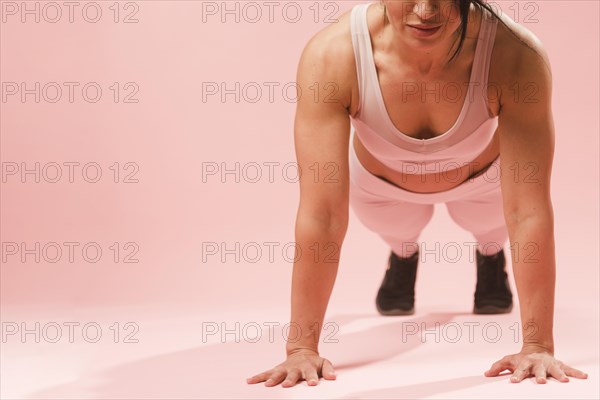Athletic woman doing push up