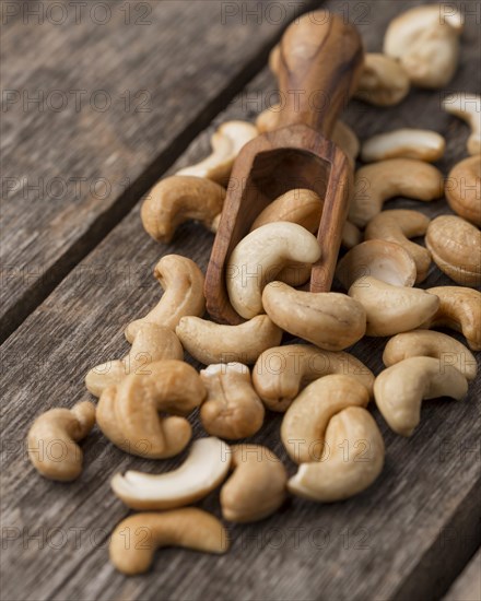 Healthy raw cashew nuts small wooden spoon