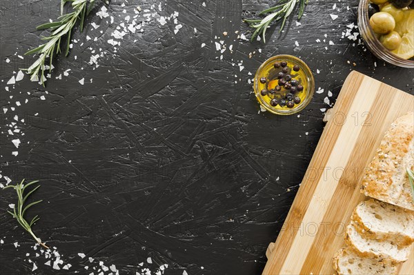 Table with cutting board bread with oil