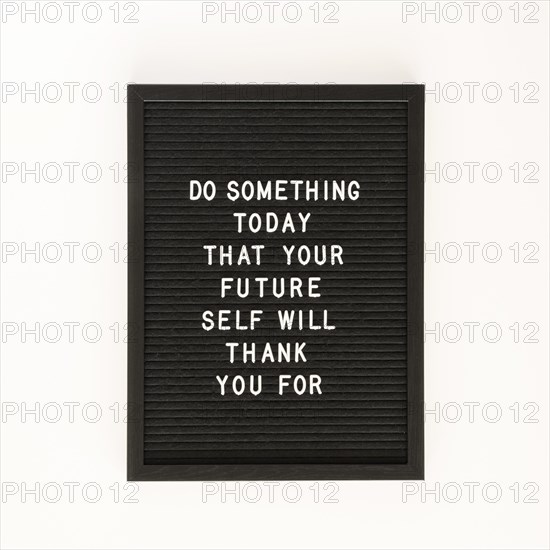 Black motivational text board top view