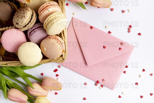 Top view basket macarons envelope valentines day