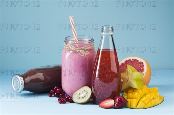 Colorful smoothie bottles fruit