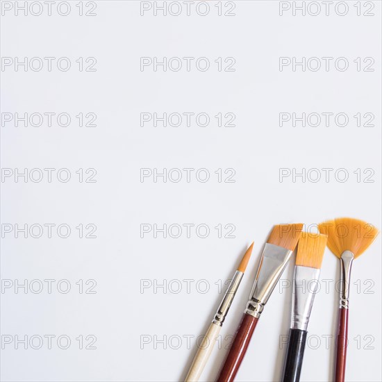 Paintbrushes white surface