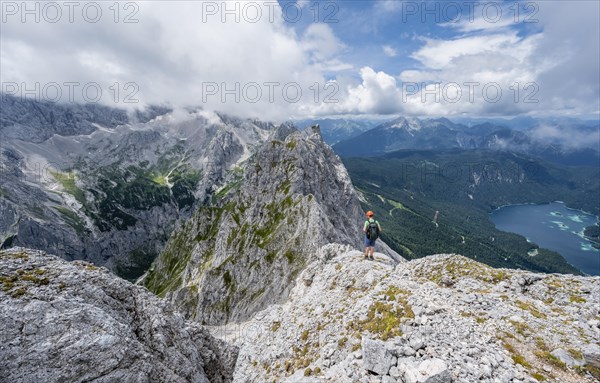 Mountaineer at the summit of the Waxenstein