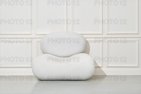 Large soft pouf or beanbag chair in bright room