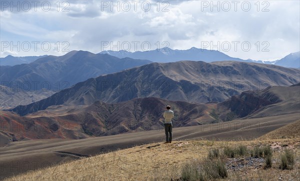 Tourist looking over landscape