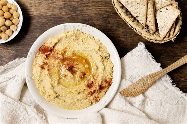 Flat lay bowl hummus with chickpeas