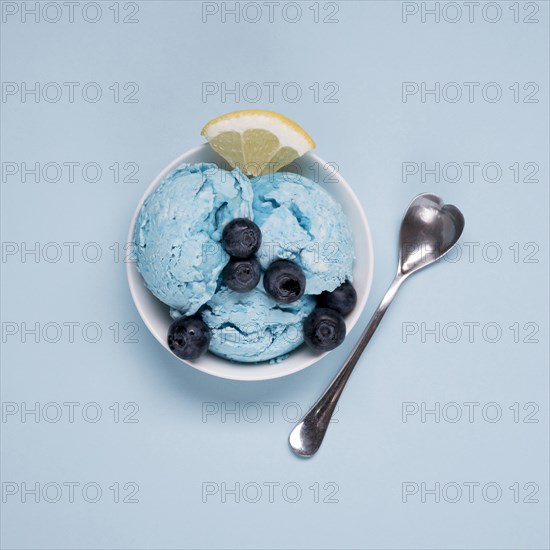 Top view tasty ice cream with spoon table