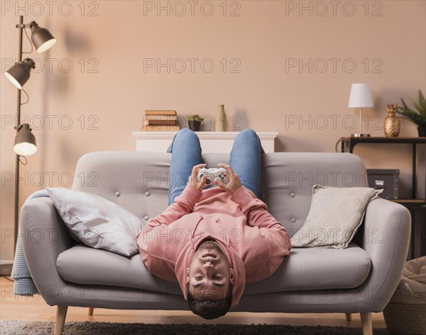 Man with head upside down playing game