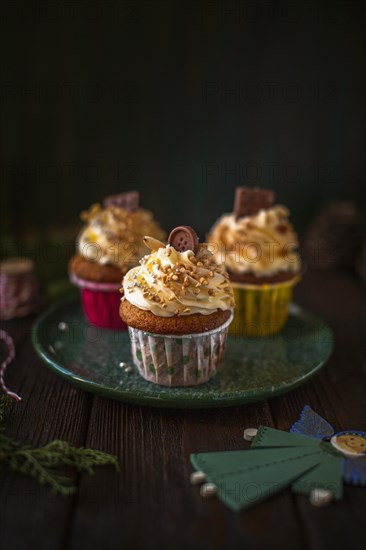 Front view decorated cupcakes with christmas ornaments