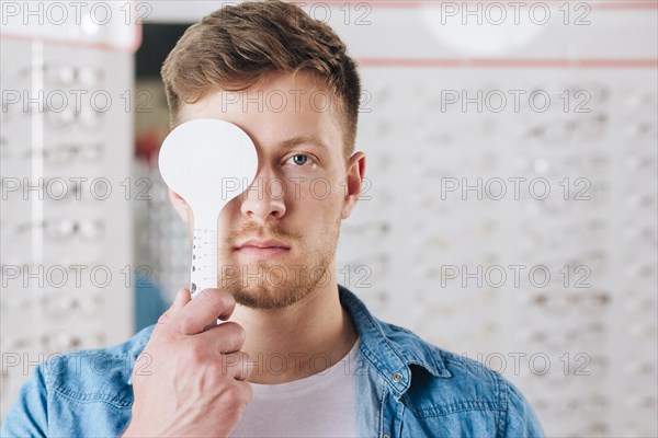 Portrait man doing test eye vision