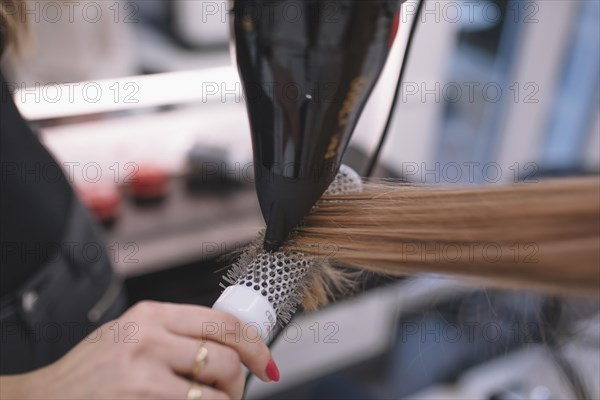 Crop hairdresser styling customer