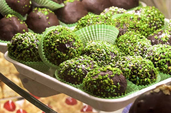 Chocolate biscuits with pistachios on tray