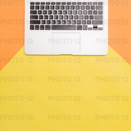 Flat lay laptop colorful background