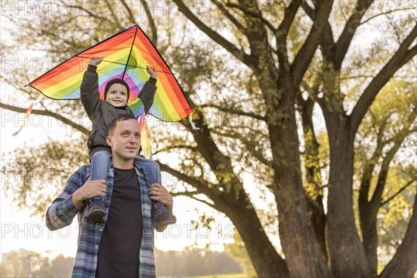 Father son playing with kite