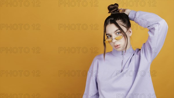 Portrait young woman wearing sunglasses