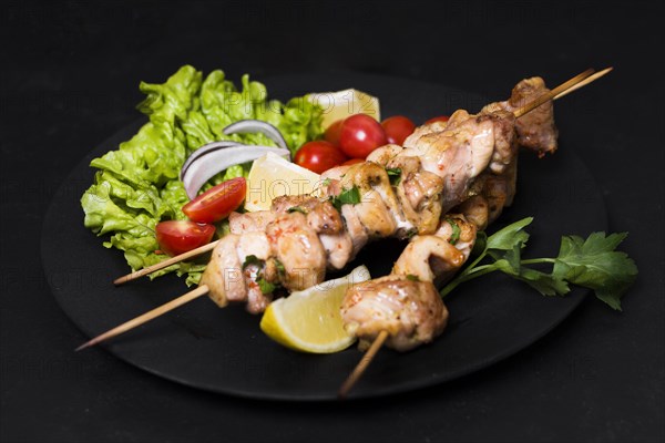 Cooked meat veggies kebab high view