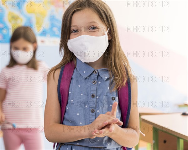 Front view beautiful girls with face mask