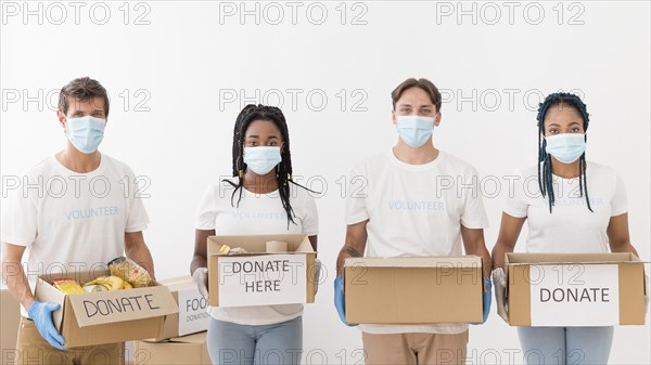 Front view people preparing donations packages