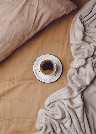 Top view morning coffee cup bed