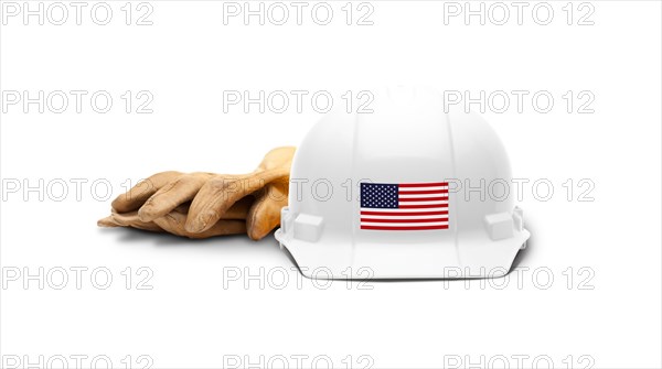 White hardhat with an american flag decal on the front and gloves isolated on white background