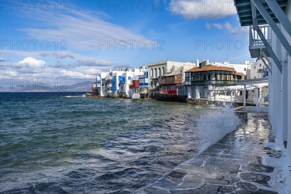 White Cycladic houses on the shore