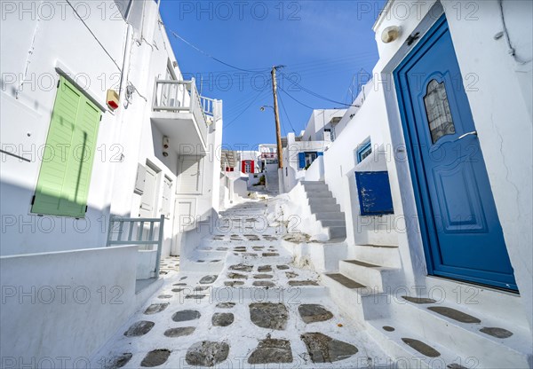 Cycladic white houses with colourful shutters and doors