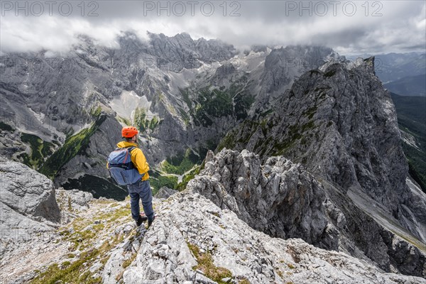 Mountaineer at the summit of the Waxenstein