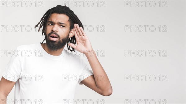 Man gesturing cant hear sign