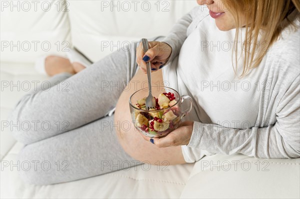 Pregnant lady eating salad