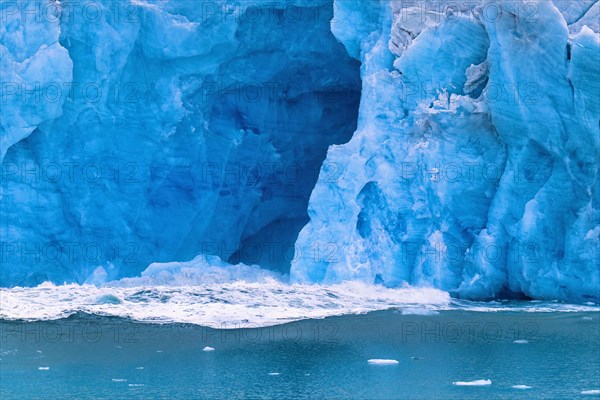 Water wave after a calving glacier in the sea