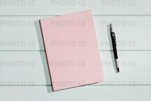 Pink cover notepad with pen