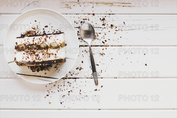 Spoon near piece cake