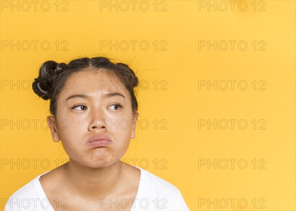 Sad asian woman with tied hair copy space