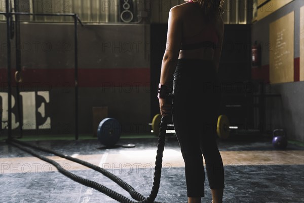 Woman holding rope gym