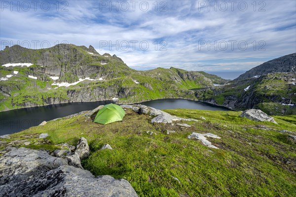 Green tent in the mountains