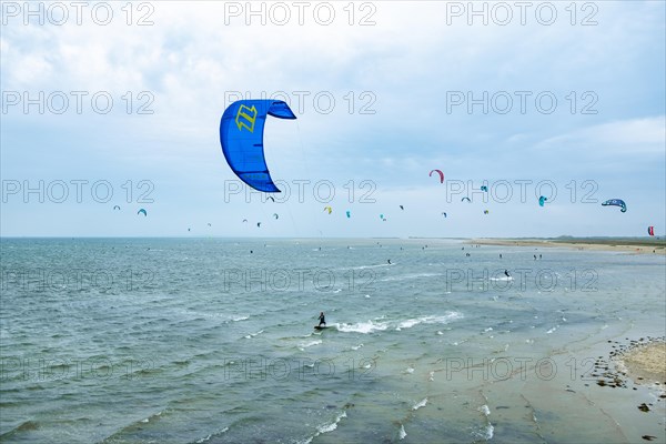 Kite surfers on the green beach of Terschelling