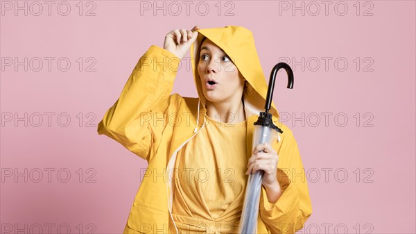 Curious woman holding umbrella