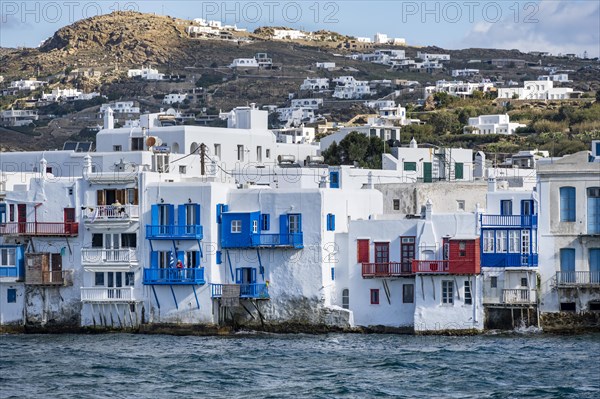 White Cycladic houses on the shore