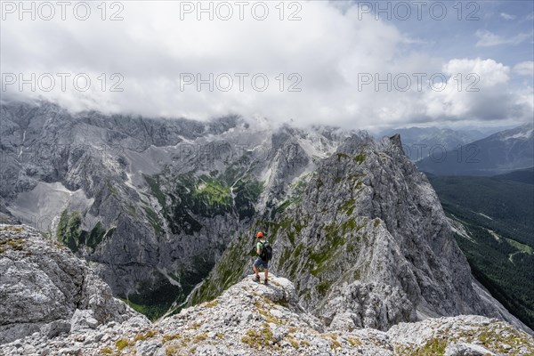 Mountaineer at the summit of the Waxenstein