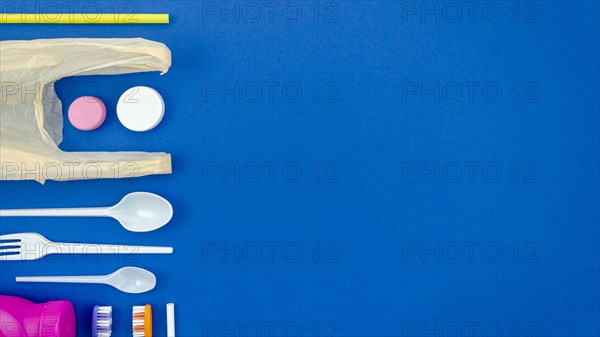 Colorful spoons blue background