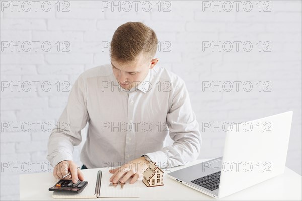 Man accounting laptop