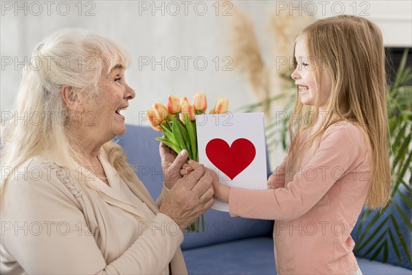 Grandma with flowers from little girl