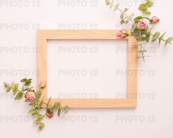 Wooden picture frame decorated with pink roses eucalyptus