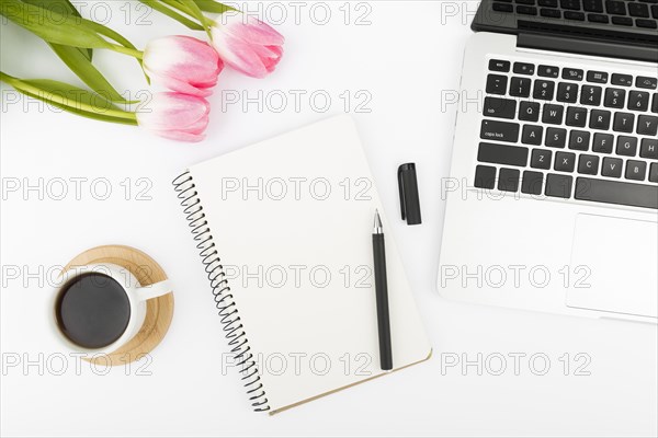 Flat lay desk concept with tulips