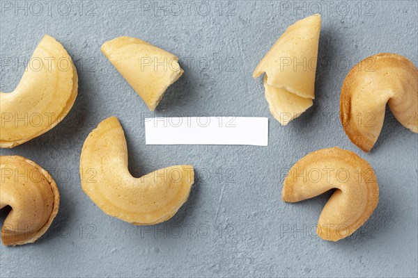 Flat lay fortune cookies with blank note