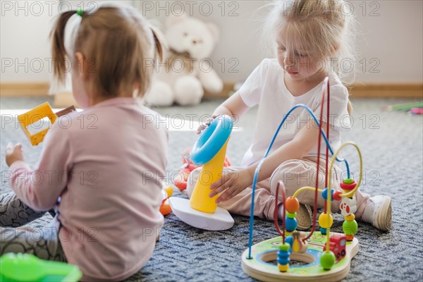 Girls with educational toys