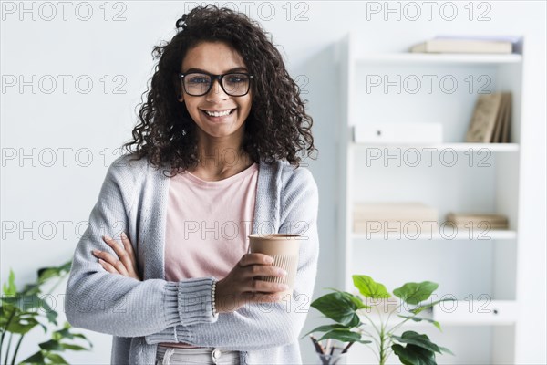 Beautiful young female with paper cup office