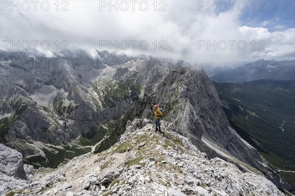 Mountaineer at the summit of the Waxenstein