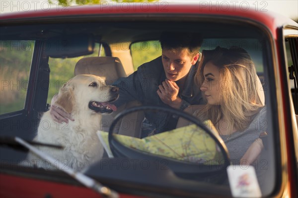 Young family road trip with their dog